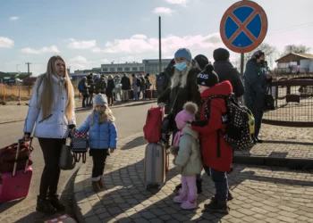 A slow but steady stream of people cross the border into Medyka, Poland from Ukraine in the hours after bombing started outside Lviv on Thursday. ANNA LIMINOWICZ /THE GLOBE AND MAIL