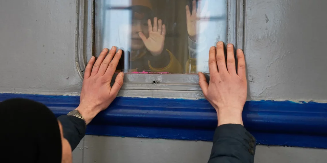 A man sees off his wife and children on the train to Poland at the Lviv railway station. March 14, 2022. Photo by Bryan Smith / Zuma Press / Forum