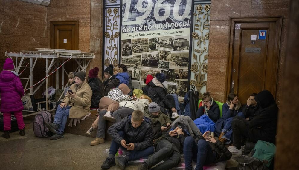 People rest in the Kyiv subway, using it as a bomb shelter in Kyiv, Ukraine, Thursday, Feb. 24, 2022. (AP Photo/Emilio Morenatti)