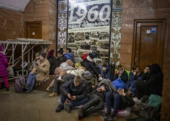 People rest in the Kyiv subway, using it as a bomb shelter in Kyiv, Ukraine, Thursday, Feb. 24, 2022. (AP Photo/Emilio Morenatti)