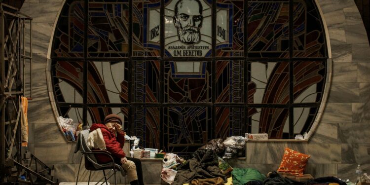 A woman rests as residents find shelter from shelling in a metro station, amid Russia's attack on Ukraine, in Kharkiv, Ukraine, April 11, 2022. (REUTERS PHOTO)