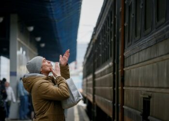 A man says goodbye to his relatives as an evacuation train from Kyiv to Lviv leaves from Kyiv central train station, March 6. REUTERS/Gleb Garanich