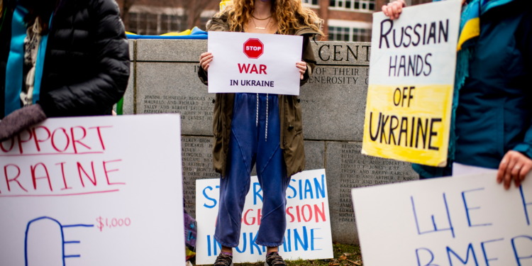 Ukrainian Cultural Club gather on Centennial Common in response to Russia invasion on Feb. 24, 2022. Photo by Matthew Modoono/Northeastern University