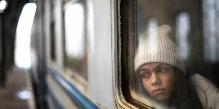 Most refugees are crossing the border into Poland, like this girl who travelled from Lviv. Photo by GETTY IMAGES