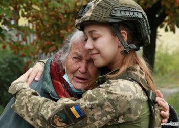 Sviatohirs'k, eastern Ukraine. An old woman is crying and hugging a Ukrainian paramedic who entered her hometown with the Ukrainian Army after months of the Russian occupation. Photo by ArmyInform