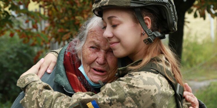 Sviatohirs'k, eastern Ukraine. An old woman is crying and hugging a Ukrainian paramedic who entered her hometown with the Ukrainian Army after months of the Russian occupation. Photo by ArmyInform