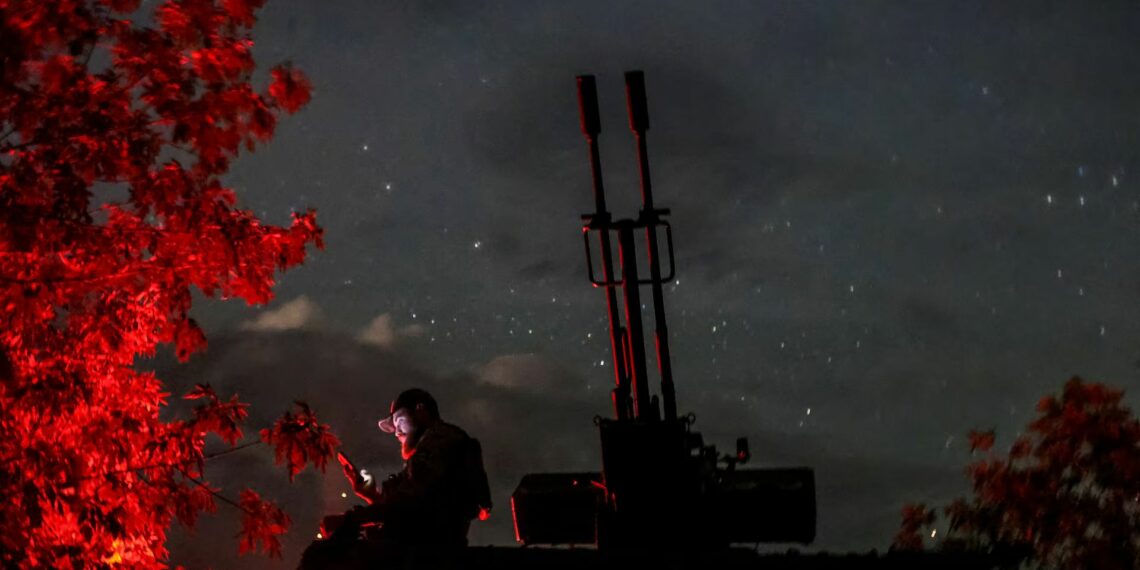 A Ukrainian serviceman from an anti-drone mobile air defence unit uses his mobile device near a ZU-23-2 anti aircraft cannon as he waits for Russian kamikaze drones, in Kherson region, Ukraine, June 11. REUTERS/Ivan Antypenko