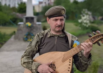 Courtesy of the 241st Territorial Defense Brigade Taras Kompanichenko, performing on the outskirts of Kyiv.