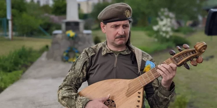 Courtesy of the 241st Territorial Defense Brigade Taras Kompanichenko, performing on the outskirts of Kyiv.