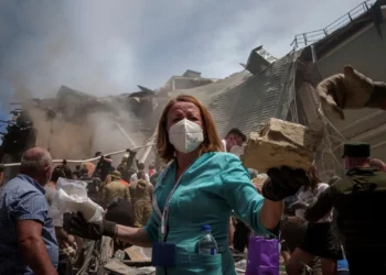 Emergency workers remove rubble and look for survivors at the site of Okhmatdyt children's hospital after it was hit by Russian missiles, in Kyiv, Ukraine, July 8, 2024. © 2024 AP Photo/Evgeniy Maloletka