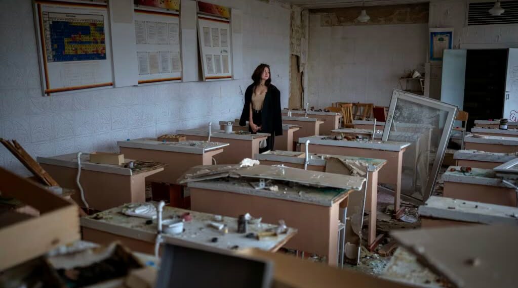 "What happened is a tragedy. I have already cried out about everything I lost. I miss my school, friends, and teachers." said student, 16, as she views her former classroom that was bombed by Russian forces. Photo by Emilio Morenatti / AP