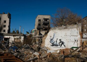 The Banksy graffiti depicting Putin being flipped during a judo match with a young boy on a wall in Borodyanka, near the capital Kyiv ©Getty Images