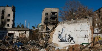 The Banksy graffiti depicting Putin being flipped during a judo match with a young boy on a wall in Borodyanka, near the capital Kyiv ©Getty Images